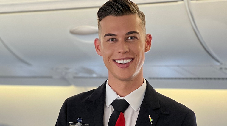 Cabin crew member smiling at camera